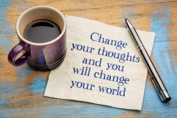 Change your thoughts and you will change your world - handwriting on a napkin with a cup of espresso coffee. Change your Mind and the Rest Will Follow