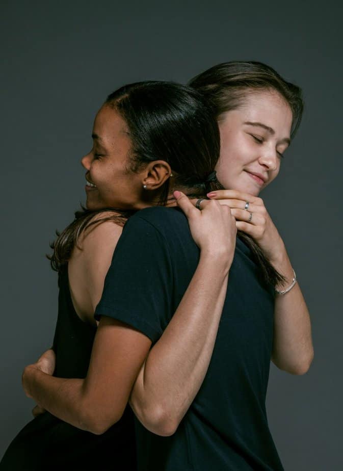 Two woman hugging in terms of Acceptance is the objective