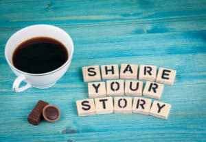 share your story. Coffee mug and wooden letters on wooden background. The Best Way to Recover Your True Self