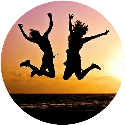 Two women exuberantly leaping into the air with joy, exemplifying the essence of 