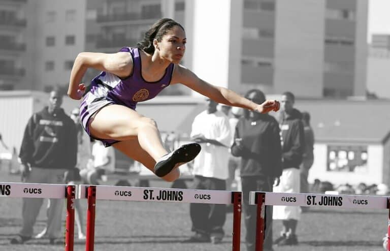 Dealing With Your Obstacles with a woman jumping over a obstacles
