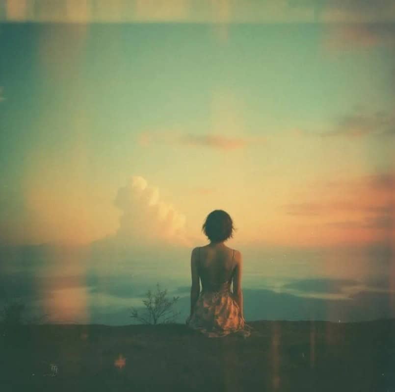 Woman sitting facing view